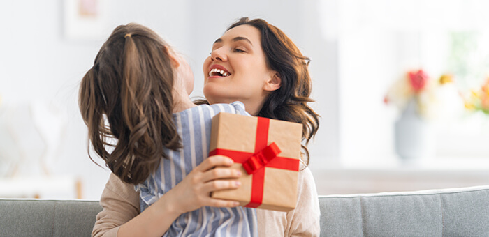 Mother and daughter with gift