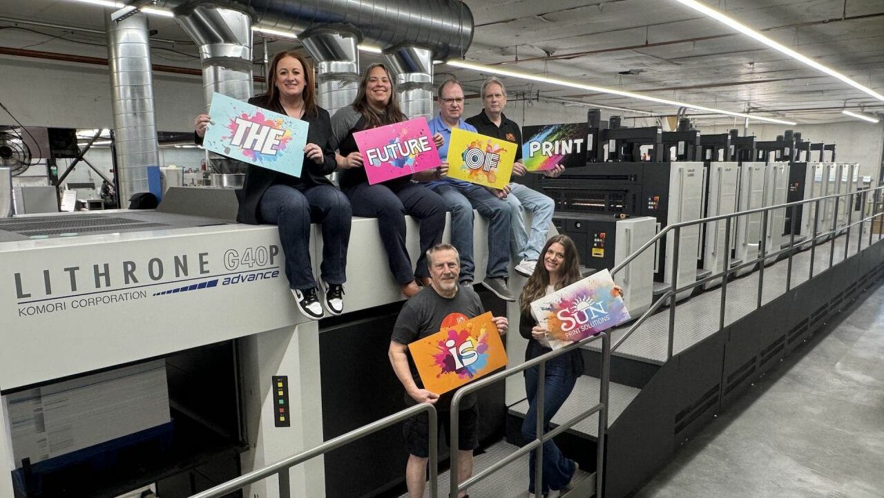 Sun Print Solutions Staff on Printer