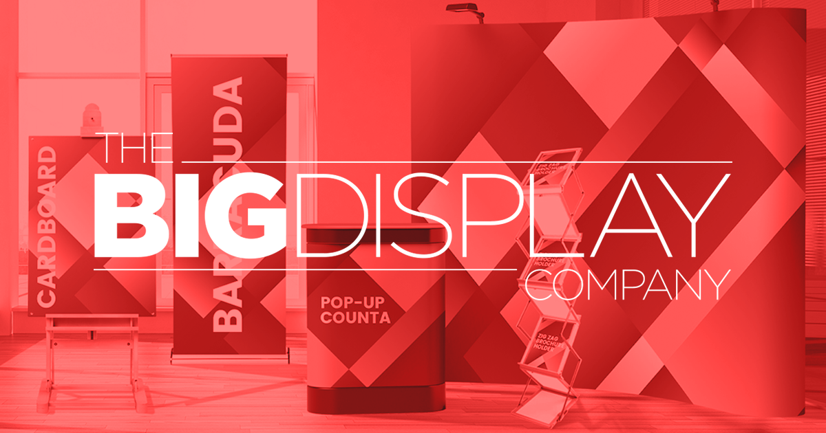 The Big Display Company Logo in white over a Coral Overlay with Branded Wide-Format products in the Background