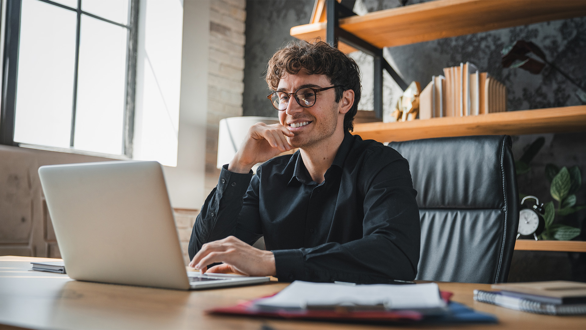 Man on a video call at a desk