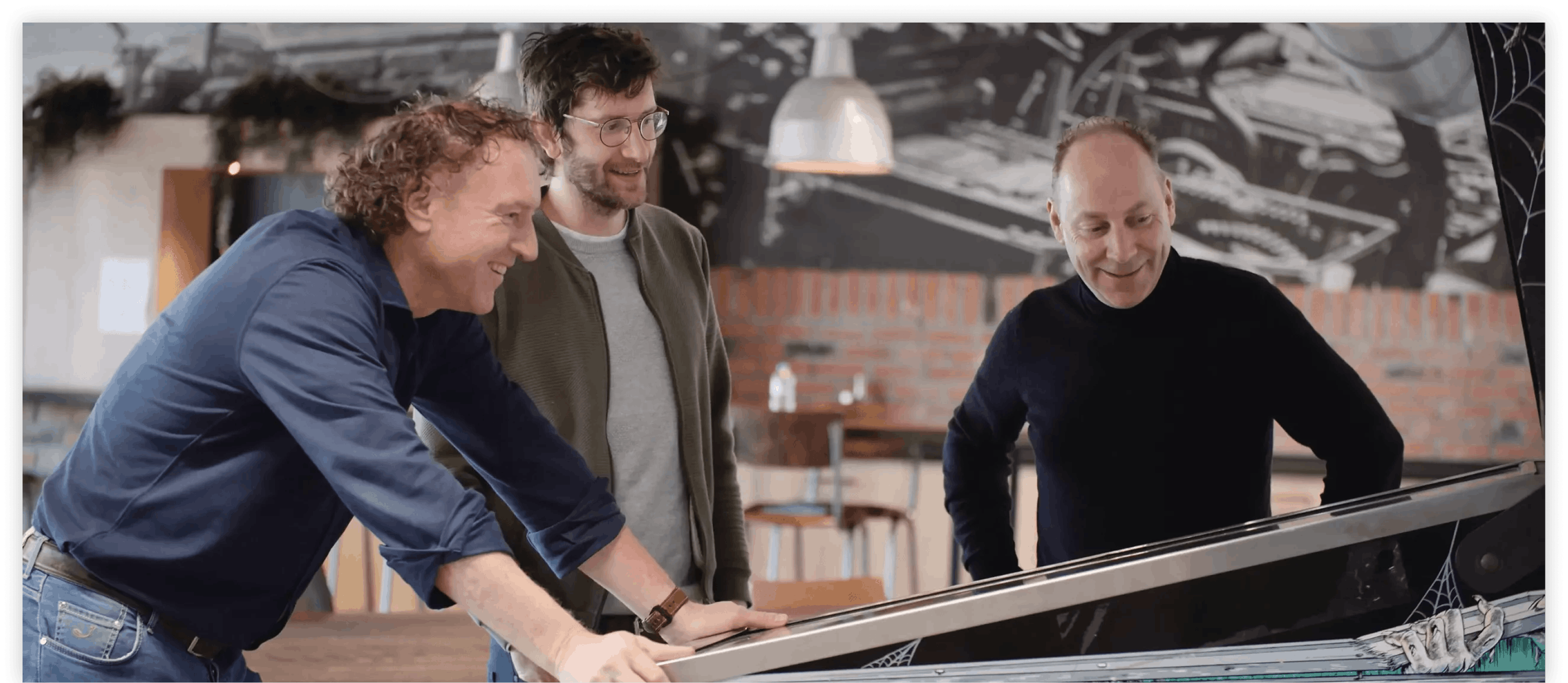 Boris Antonissen and colleagues playing on arcade