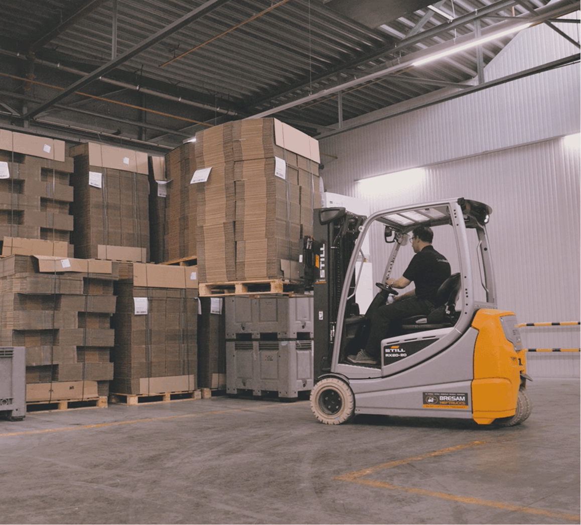 Forkflift operator moving packaging material