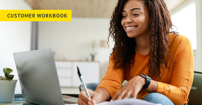 Woman working happily on laptop
