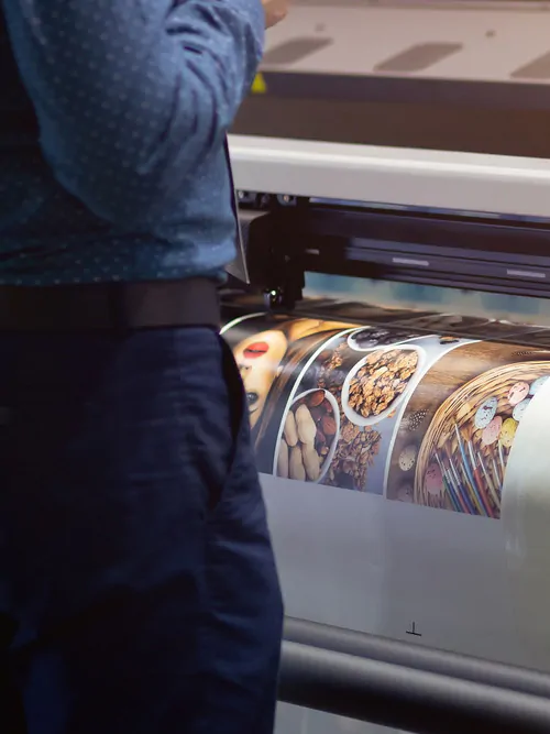 Man Observing Industrial Printer