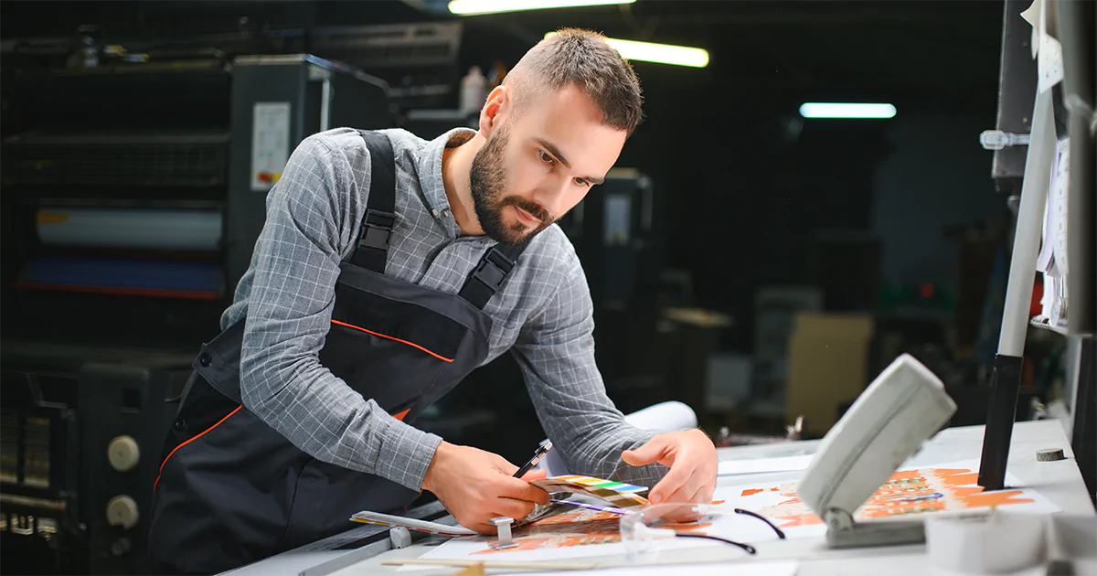 Print Business Owner Reviewing Orders in Print Warehouse